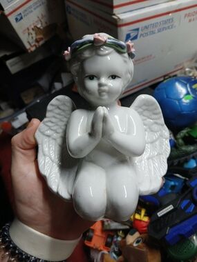 vintage white ceramic praying angel cherub figurine.